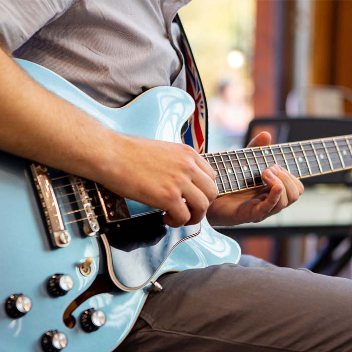 Guitarist plays live music at Cadence Clubhouse in Allison Park, PA