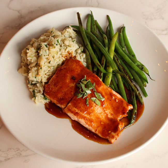 Catered salmon with side of rice and green beans at Cadence Clubhouse in Allison Park, PA